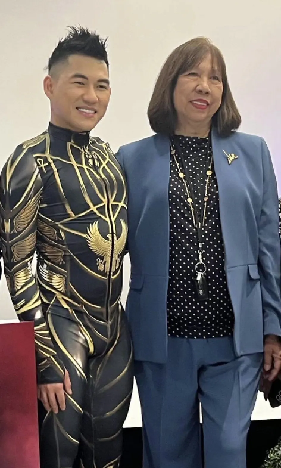 A performer in a gold costume with Margie