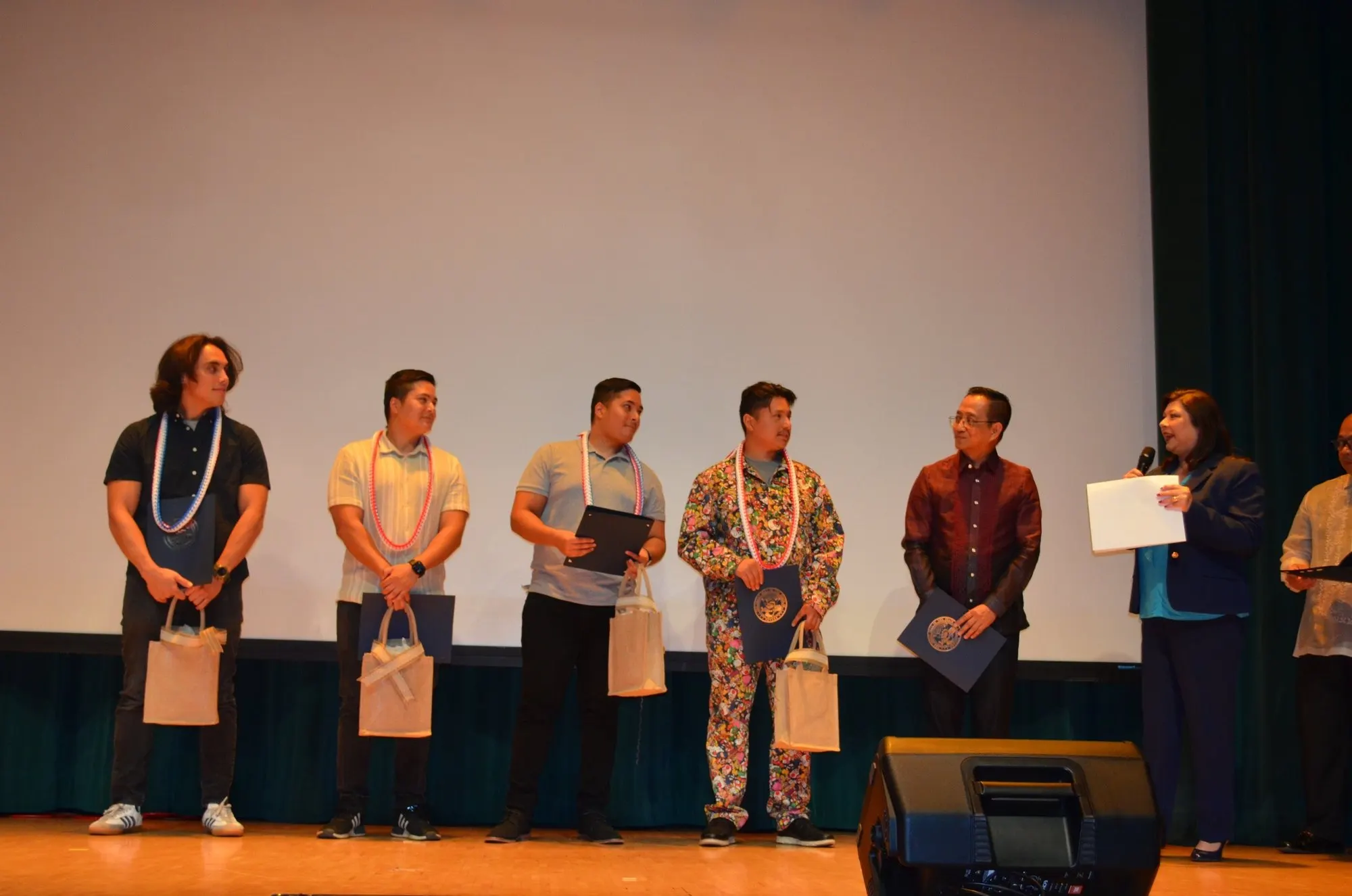 Honorees on stage at a community event