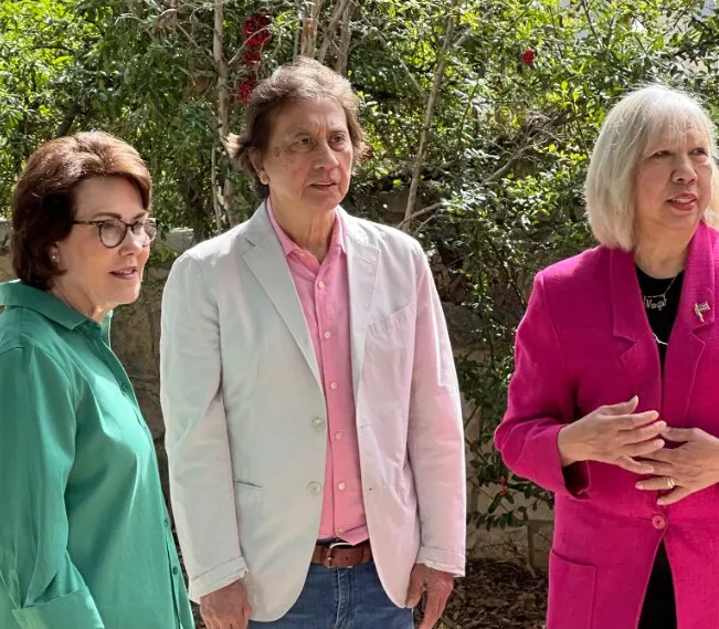 Margie with guests in a garden