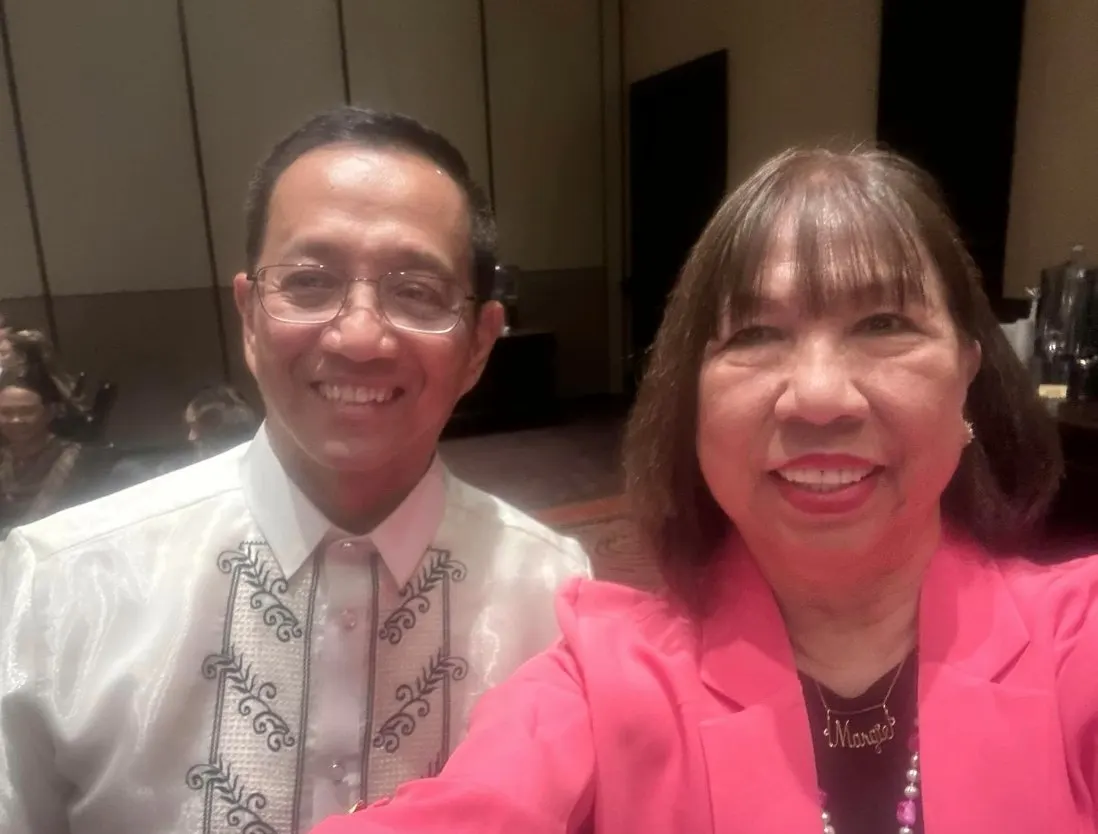 Margie with a guest in a barong