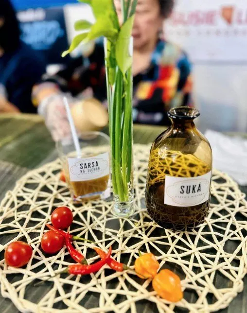 Vinegar and chilies on a Kamayan table